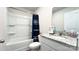 Clean bathroom with granite countertop and a shower/tub combo at 1401 Nia Rd, Charlotte, NC 28215