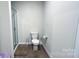 Simple bathroom with toilet and shower at 1401 Nia Rd, Charlotte, NC 28215