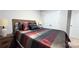 Well-lit bedroom with a double door closet and wood furniture at 1401 Nia Rd, Charlotte, NC 28215