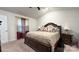 Spacious bedroom with king-size bed and large windows at 1401 Nia Rd, Charlotte, NC 28215