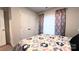 Spacious bedroom with double doors and a large window at 1401 Nia Rd, Charlotte, NC 28215