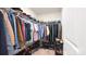 Large walk-in closet with ample shelving and rods at 1401 Nia Rd, Charlotte, NC 28215