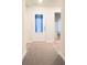 Bright and airy entryway with neutral colors and a modern door at 1401 Nia Rd, Charlotte, NC 28215