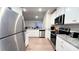 Open concept kitchen with stainless steel appliances at 1401 Nia Rd, Charlotte, NC 28215