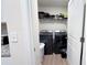 Laundry room with washer, dryer, and shelving at 1401 Nia Rd, Charlotte, NC 28215