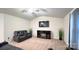 Spacious living area with a fireplace and reclining furniture at 1401 Nia Rd, Charlotte, NC 28215