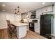 Modern basement kitchen with gray cabinets and granite counters at 1563 Rhyne Rd, Dallas, NC 28034