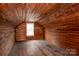 Unfinished attic space with wood walls and flooring at 1781 33Rd Street Sw Dr, Hickory, NC 28602