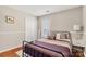 Bedroom with full-size bed and hardwood floors at 1919 Crooked Creek Dr, Charlotte, NC 28214