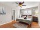 Spacious bedroom with hardwood floors and ceiling fan at 1919 Crooked Creek Dr, Charlotte, NC 28214