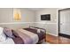 Bedroom with full-size bed and hardwood floors at 1919 Crooked Creek Dr, Charlotte, NC 28214