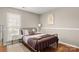 Cozy bedroom with full-size bed and hardwood floors at 1919 Crooked Creek Dr, Charlotte, NC 28214