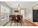Bright dining room with large windows and wood table with six chairs at 1919 Crooked Creek Dr, Charlotte, NC 28214