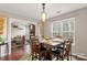 Dining room with hardwood floors and view into living room and kitchen at 1919 Crooked Creek Dr, Charlotte, NC 28214