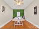 Game room with pool table and artificial turf accent wall at 1919 Crooked Creek Dr, Charlotte, NC 28214