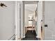 Bright hallway with view of kitchen and bedrooms at 1919 Crooked Creek Dr, Charlotte, NC 28214