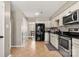 Kitchen with black refrigerator and stainless steel appliances at 1919 Crooked Creek Dr, Charlotte, NC 28214