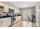 Bright kitchen with stainless steel appliances and white cabinets at 1919 Crooked Creek Dr, Charlotte, NC 28214