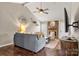 Spacious living room featuring a brick fireplace and hardwood floors at 1919 Crooked Creek Dr, Charlotte, NC 28214