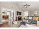 Living room with vaulted ceiling, hardwood floors and view into dining area at 1919 Crooked Creek Dr, Charlotte, NC 28214