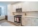 Modern kitchen with white cabinets and stainless steel appliances at 2401 Euclid Ave # 302, Charlotte, NC 28203