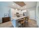 Modern kitchen with white cabinets, stainless steel appliances, and an island at 2401 Euclid Ave # 302, Charlotte, NC 28203