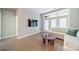 Bright living room with hardwood floors and access to a patio at 2401 Euclid Ave # 302, Charlotte, NC 28203