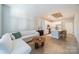 Open concept living room with hardwood floors and modern decor at 2401 Euclid Ave # 302, Charlotte, NC 28203