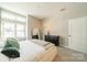 Main bedroom featuring a large window with shutters at 2401 Euclid Ave # 302, Charlotte, NC 28203