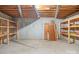 Unfinished basement with shelving units at 2510 Burton Estates Ln, Lincolnton, NC 28092