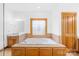 Bathroom featuring a jetted tub and wood cabinetry at 2510 Burton Estates Ln, Lincolnton, NC 28092