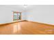 Spacious bedroom with hardwood floors and large window at 2510 Burton Estates Ln, Lincolnton, NC 28092
