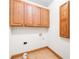 Laundry room with wood cabinets and tile floor at 2510 Burton Estates Ln, Lincolnton, NC 28092