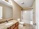 Simple bathroom with granite vanity and shower/tub combo at 8014 Bryson Rd, Fort Mill, SC 29707