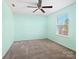 Light and airy bedroom with light teal walls and ceiling fan at 8014 Bryson Rd, Fort Mill, SC 29707