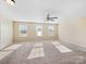 Bright and airy bedroom with neutral carpeting and large windows at 8014 Bryson Rd, Fort Mill, SC 29707