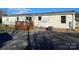 Home exterior showcasing a gravel driveway and landscaping at 816 Perry Rd, Troutman, NC 28166