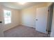 Bright bedroom with carpeted floor, large window, and ample closet space at 816 Perry Rd, Troutman, NC 28166