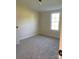 Bright and airy bedroom with a large window and neutral decor at 816 Perry Rd, Troutman, NC 28166
