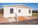 House exterior with a deck and landscaped area at 816 Perry Rd, Troutman, NC 28166