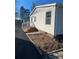 House exterior showcasing a newly landscaped yard and steps at 816 Perry Rd, Troutman, NC 28166