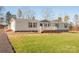 Ranch style home with landscaping and driveway at 816 Perry Rd, Troutman, NC 28166