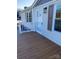 Inviting front porch with wooden deck and white railing at 816 Perry Rd, Troutman, NC 28166
