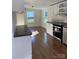 Bright kitchen featuring stainless steel appliances and hardwood floors at 816 Perry Rd, Troutman, NC 28166