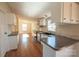 Modern kitchen with stainless steel appliances and wood flooring at 816 Perry Rd, Troutman, NC 28166
