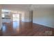 Spacious living room with hardwood floors and view to kitchen and deck at 816 Perry Rd, Troutman, NC 28166