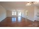 Open living area with hardwood floors and access to kitchen at 816 Perry Rd, Troutman, NC 28166