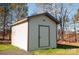 White vinyl storage shed with brown trim at 816 Perry Rd, Troutman, NC 28166