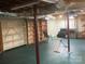 Unfinished basement with shelving and laundry area at 936 N 5Th St, Albemarle, NC 28001