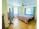 Bright bedroom with hardwood floors and large windows at 936 N 5Th St, Albemarle, NC 28001